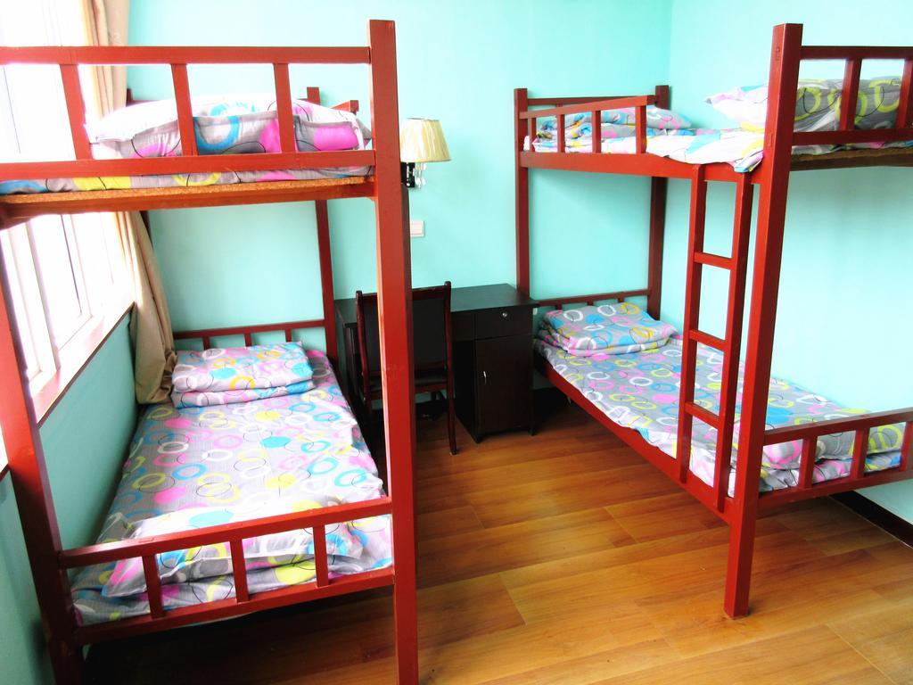 25°C Four Season Youth Hostel Qingdao Quarto foto